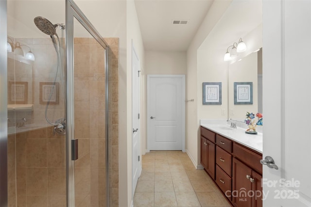 full bathroom with visible vents, a stall shower, vanity, tile patterned flooring, and baseboards