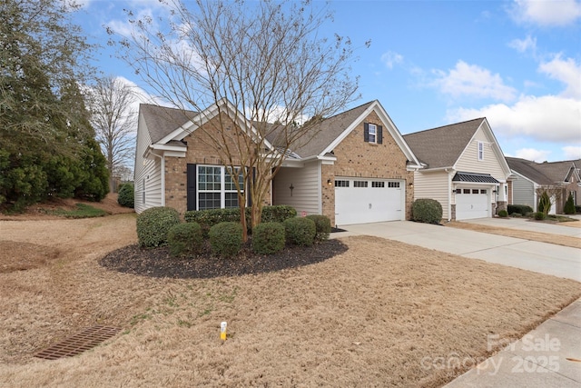 view of front facade with a garage, concrete driveway, and brick siding