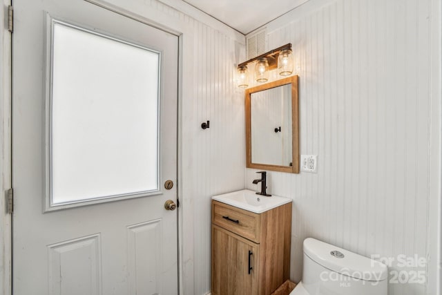 bathroom with vanity and toilet