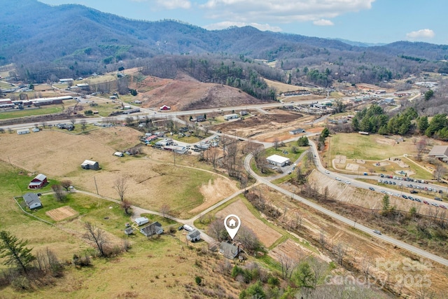 drone / aerial view with a mountain view and a rural view