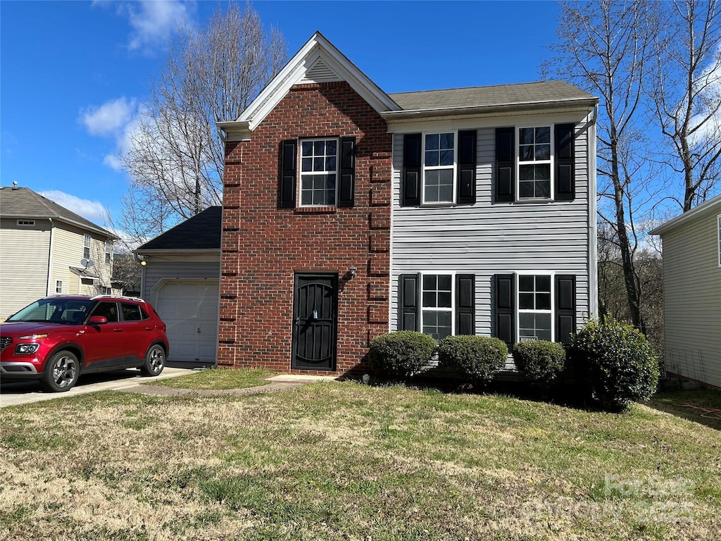 view of front of property featuring brick siding, an attached garage, and a front lawn