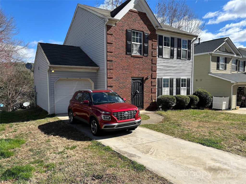 view of front of property featuring driveway, a front lawn, a garage, central air condition unit, and brick siding