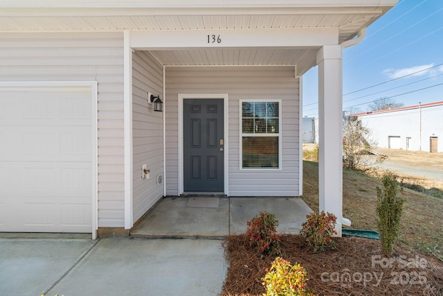 doorway to property featuring covered porch