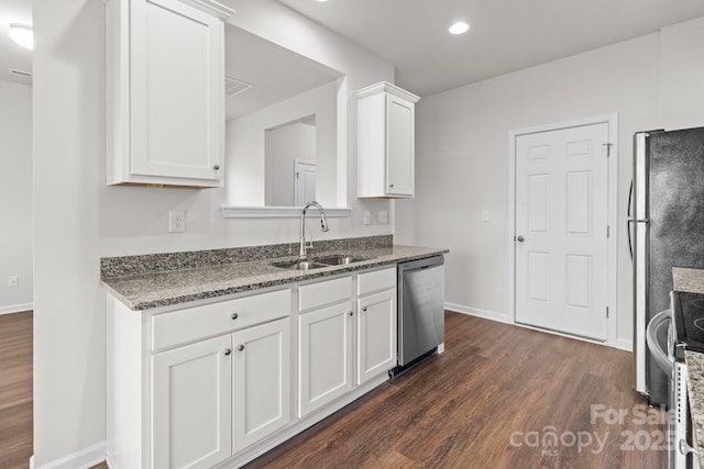 kitchen featuring stainless steel appliances, dark wood-style flooring, a sink, baseboards, and white cabinets