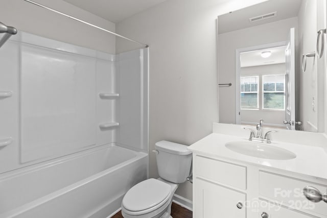 full bathroom with visible vents, shower / bathing tub combination, vanity, and toilet