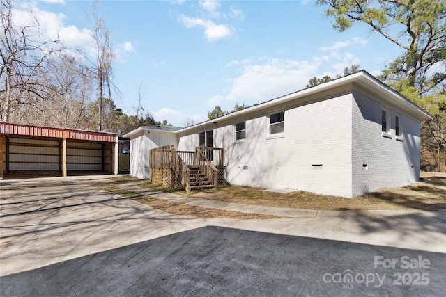 view of home's exterior featuring brick siding and crawl space