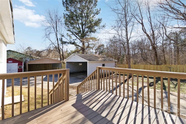 deck with an outdoor structure and fence