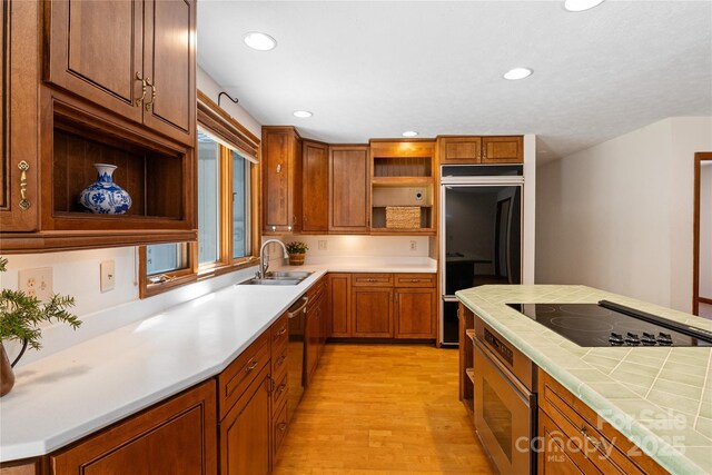 15 Elmwood Ln Unit 161, Asheville, NC 28803 - kitchen with open shelves, a sink, oven, refrigerator, and black electric cooktop