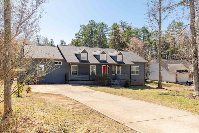 view of front of house with a shingled roof, a front yard, covered porch, and crawl space