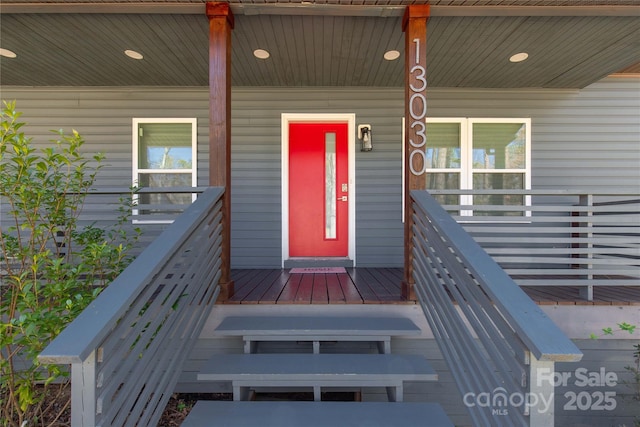 doorway to property featuring a porch