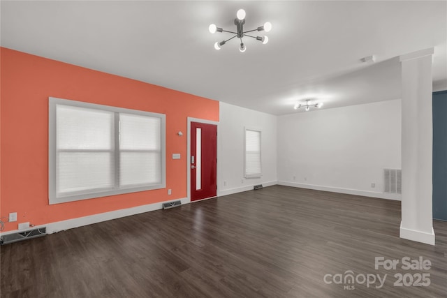 entryway with wood finished floors and visible vents