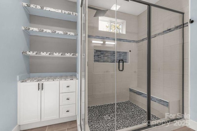 bathroom featuring a shower stall