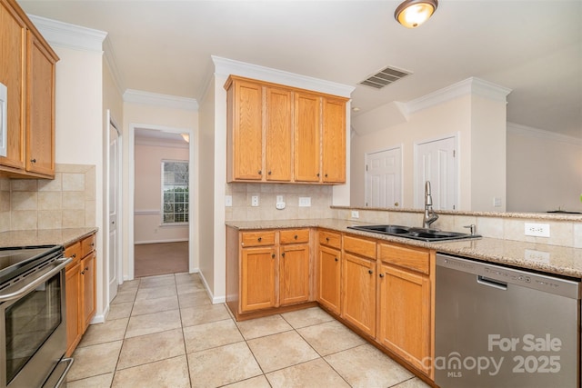 kitchen featuring light stone counters, light tile patterned floors, visible vents, a sink, and stainless steel appliances