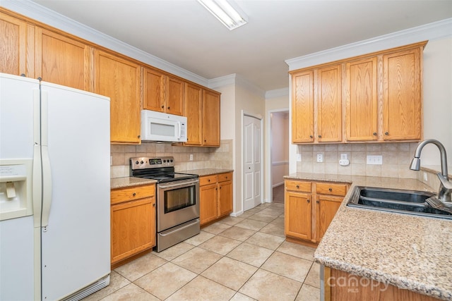 kitchen with tasteful backsplash, crown molding, light tile patterned floors, white appliances, and a sink