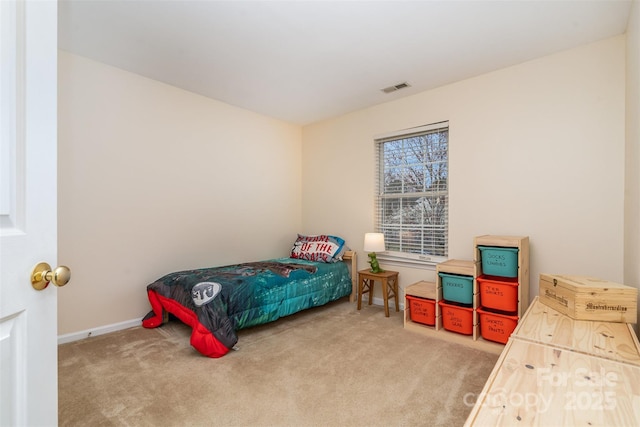 bedroom featuring carpet, visible vents, and baseboards