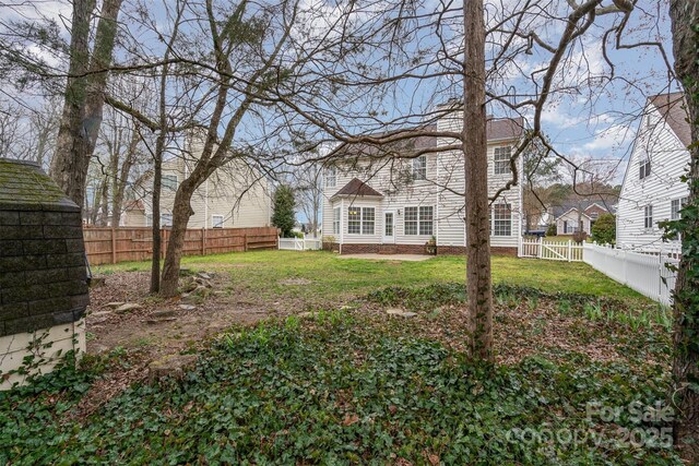 view of yard with a fenced backyard