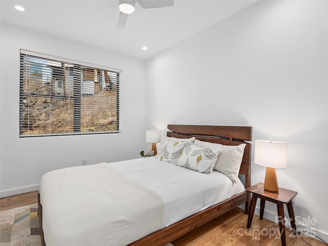 433 W Haywood St, Asheville, NC 28801 - bedroom with recessed lighting, wood finished floors, baseboards, and ceiling fan