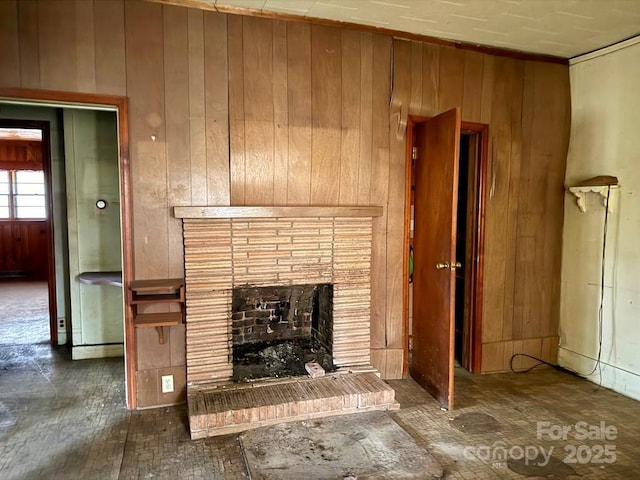 2412 Daves Dr, Shelby, NC 28152 - unfurnished living room featuring wooden walls and a fireplace
