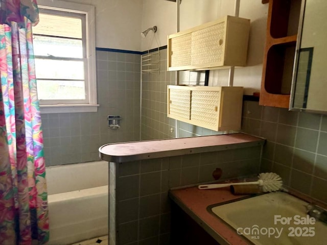2412 Daves Dr, Shelby, NC 28152 - bathroom featuring a sink, shower / bath combination with curtain, and tile walls