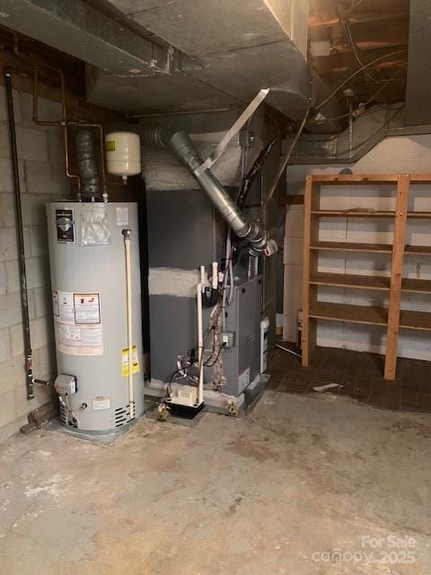 utility room featuring gas water heater and heating unit