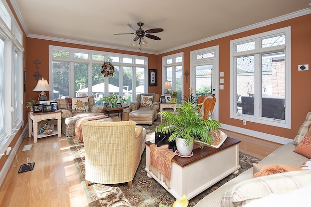 sunroom / solarium with a ceiling fan