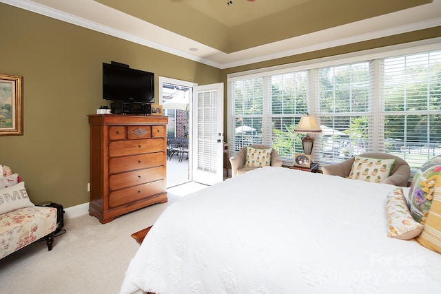 bedroom with access to exterior, light colored carpet, ornamental molding, and multiple windows