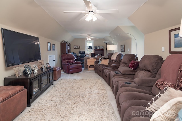 living room featuring a ceiling fan, light carpet, and vaulted ceiling