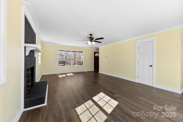 unfurnished living room with baseboards, dark wood-style flooring, a fireplace, and crown molding