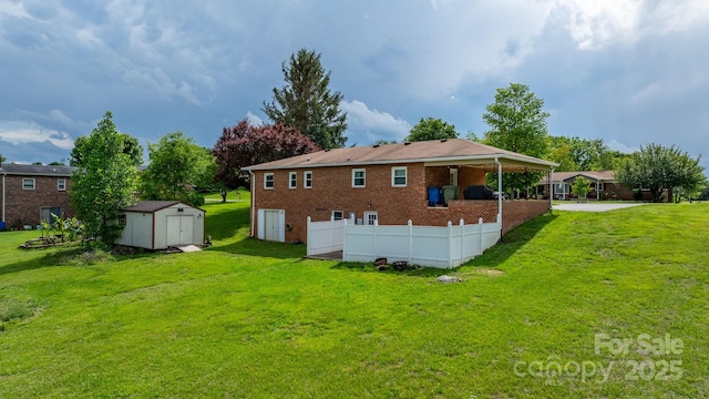 2609 Raintree St, Connelly Springs, NC 28612 - rear view of house featuring a lawn and brick siding