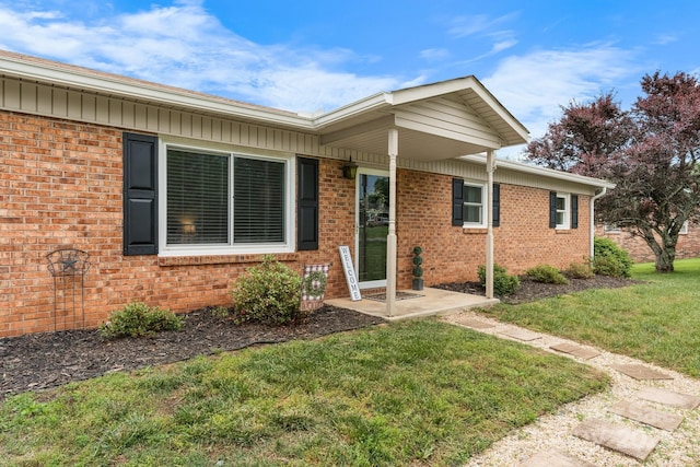 2609 Raintree St, Connelly Springs, NC 28612 - view of front of house featuring a front yard and brick siding