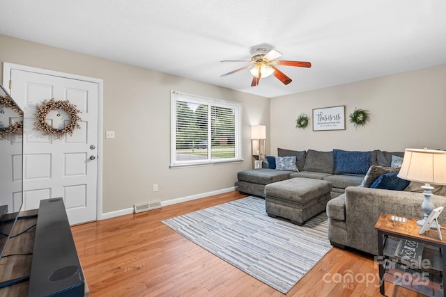 2609 Raintree St, Connelly Springs, NC 28612 - living room with a ceiling fan, light wood-style floors, and baseboards