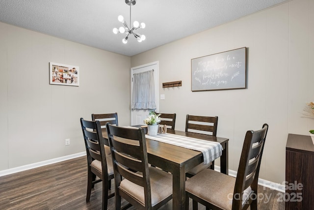 2609 Raintree St, Connelly Springs, NC 28612 - dining space with dark wood finished floors, baseboards, and a chandelier