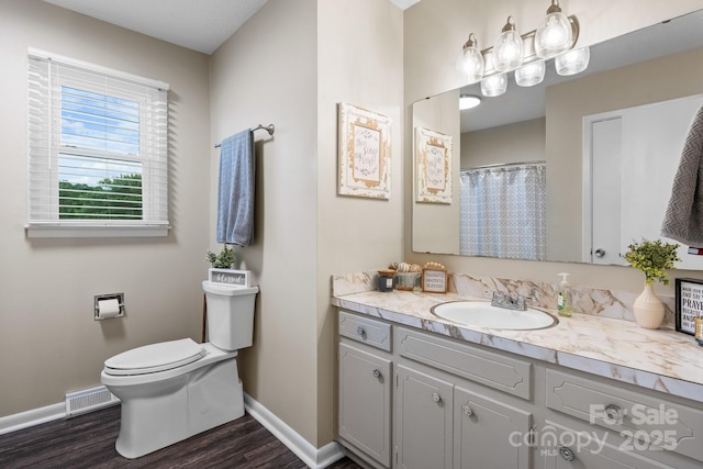 2609 Raintree St, Connelly Springs, NC 28612 - full bath featuring baseboards, wood finished floors, toilet, and vanity