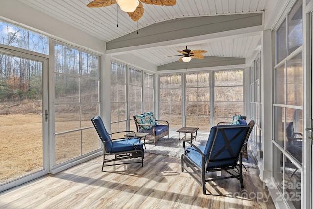 sunroom / solarium featuring lofted ceiling, wooden ceiling, and ceiling fan