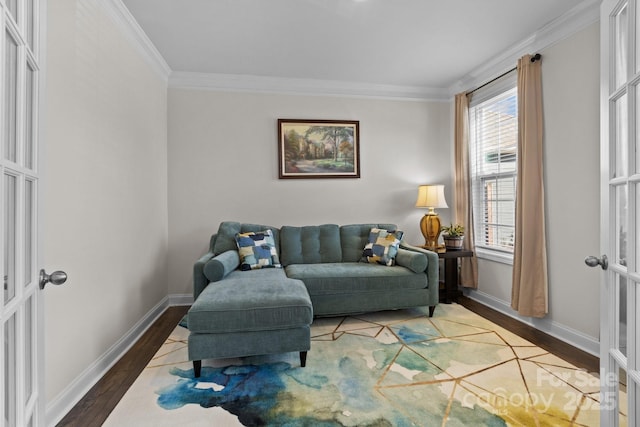 living area featuring crown molding, baseboards, wood finished floors, and french doors