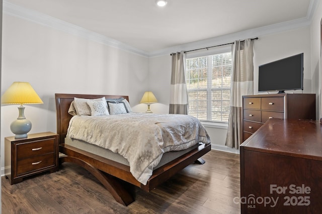 bedroom with dark wood-style floors, ornamental molding, and baseboards