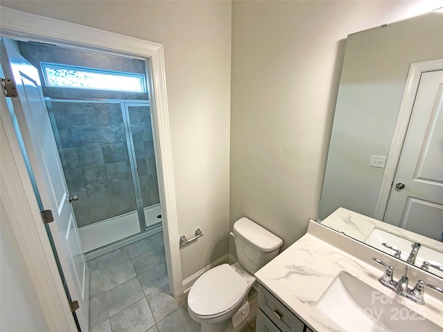 bathroom with toilet, a stall shower, vanity, and tile patterned floors