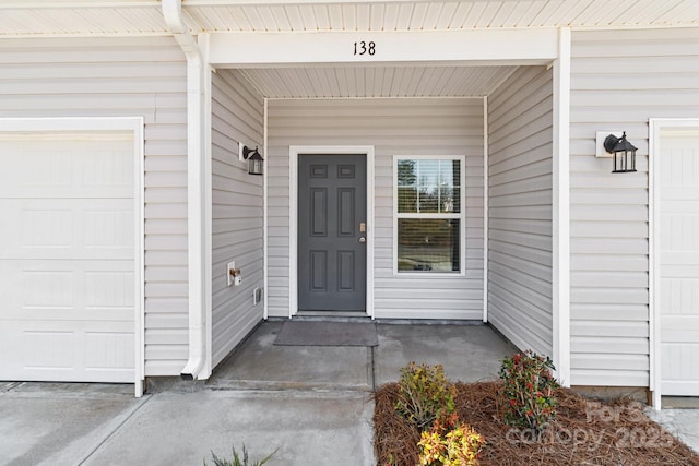 property entrance with a garage