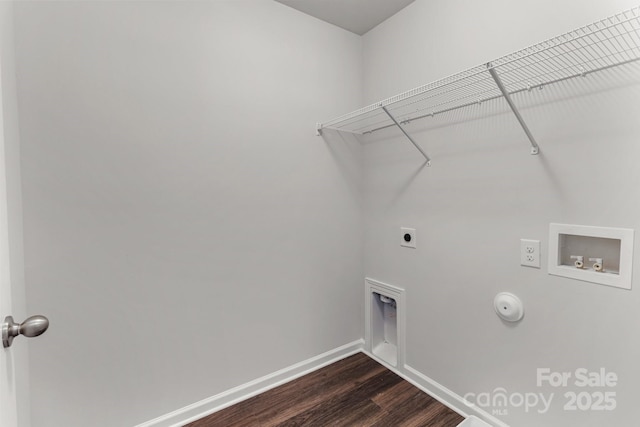 washroom featuring gas dryer hookup, hookup for a washing machine, laundry area, dark wood-type flooring, and electric dryer hookup