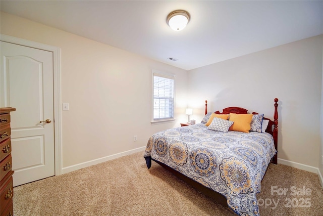 carpeted bedroom with baseboards and visible vents