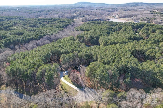 bird's eye view featuring a forest view