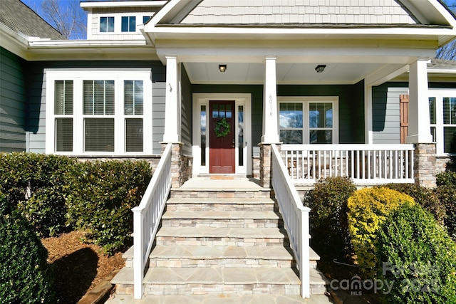 doorway to property featuring a porch