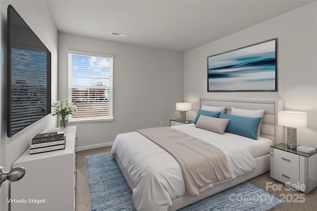 bedroom with visible vents and baseboards