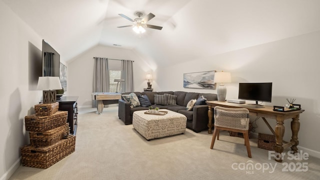 living area featuring light carpet, baseboards, a ceiling fan, and lofted ceiling