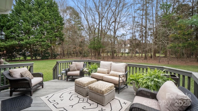 wooden terrace featuring an outdoor living space and a yard