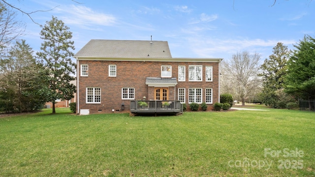 back of house featuring crawl space, a yard, brick siding, and a deck