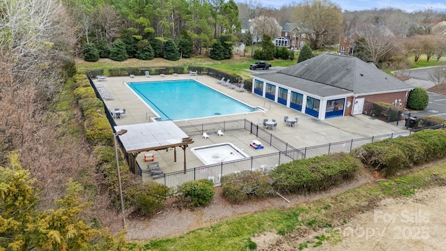 pool featuring a patio area and fence