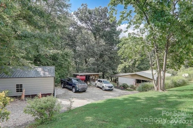 view of parking featuring driveway