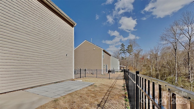 view of property exterior with fence