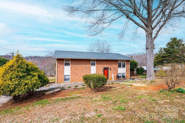 view of front of home with brick siding